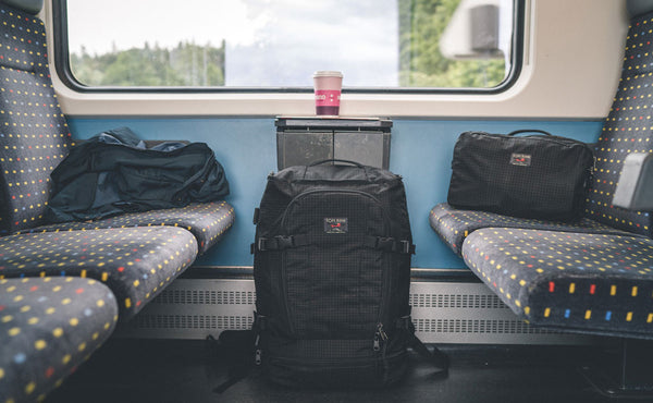 The Hero's Journey main bag and shoulderbag in a private room in a railcar.